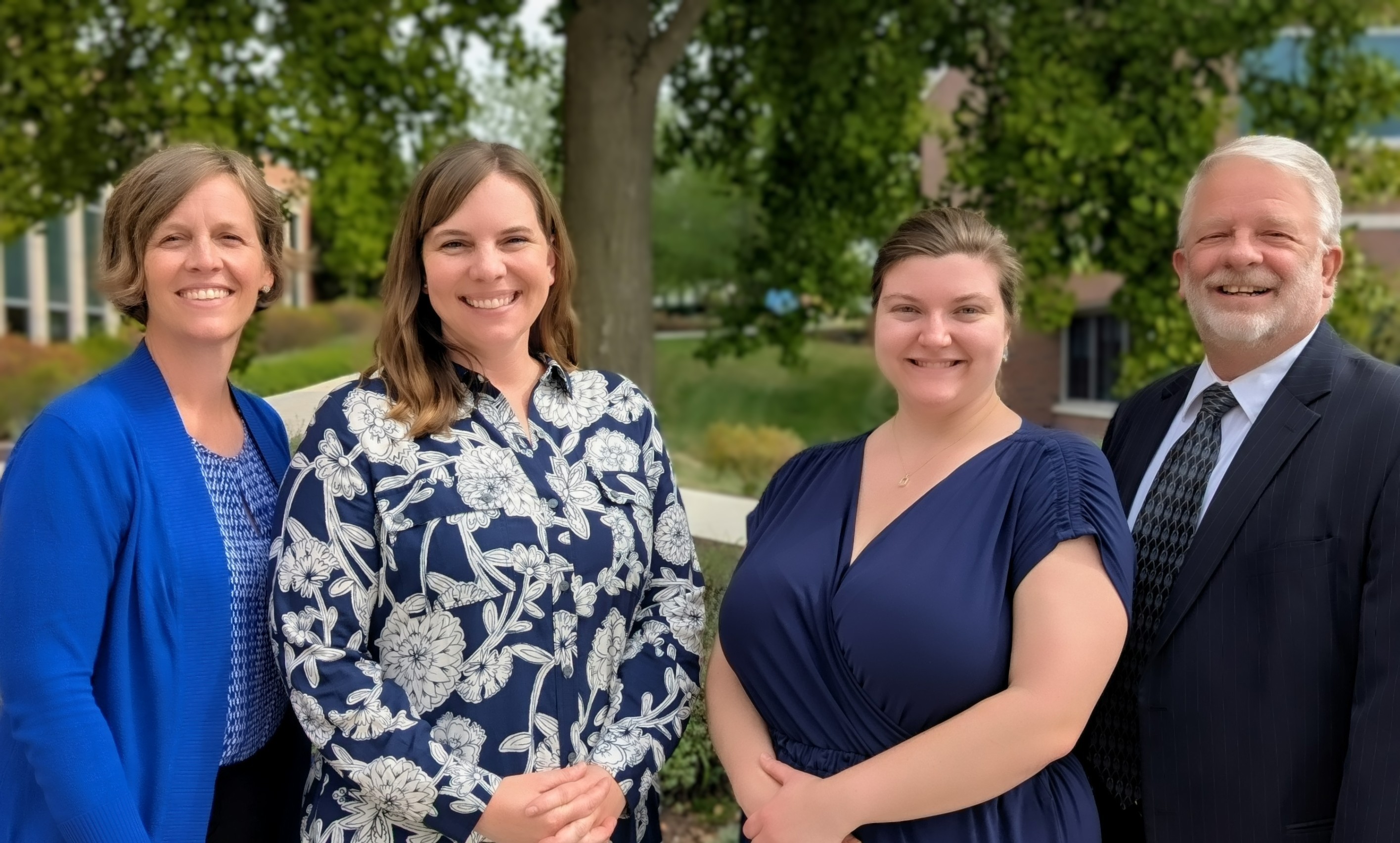 image of four staff members