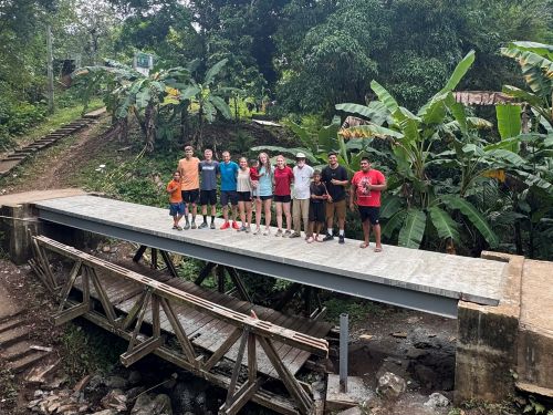 Students gathered on a bridge 