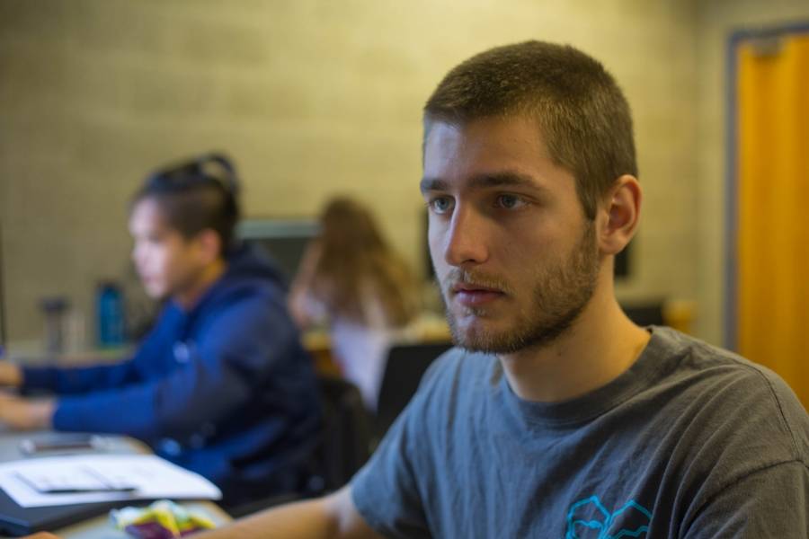 Student editing a film using Final Cut Pro