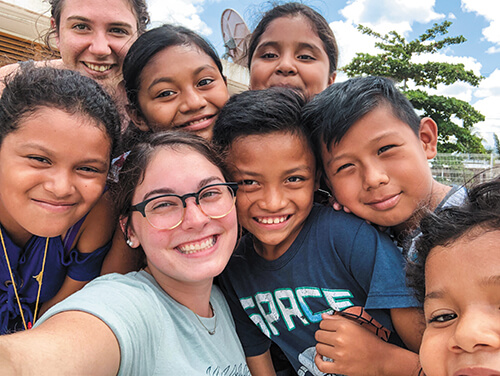 Jordan Munoz and children from her study abroad trip