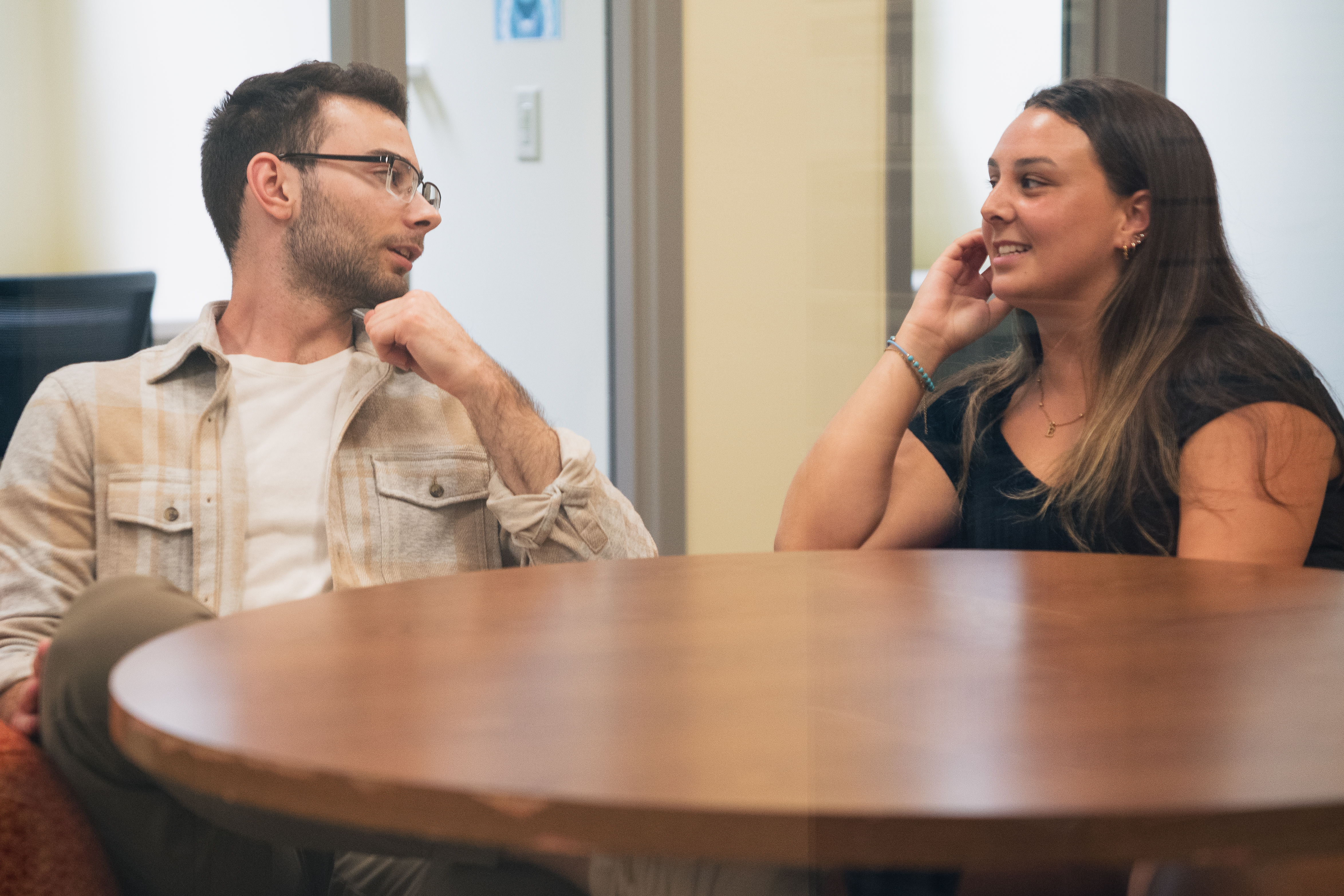 Two students speaking in the Writing Center office