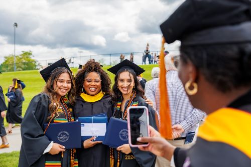 A group of multicultural female students at commencement