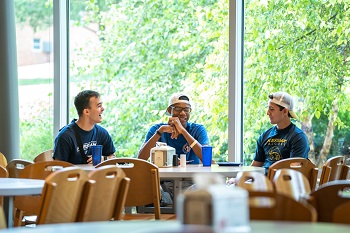 Dining Services Students at Table in Lottie