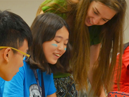 Students laughing together in a classroom