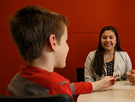 A speech language pathologist and her child client